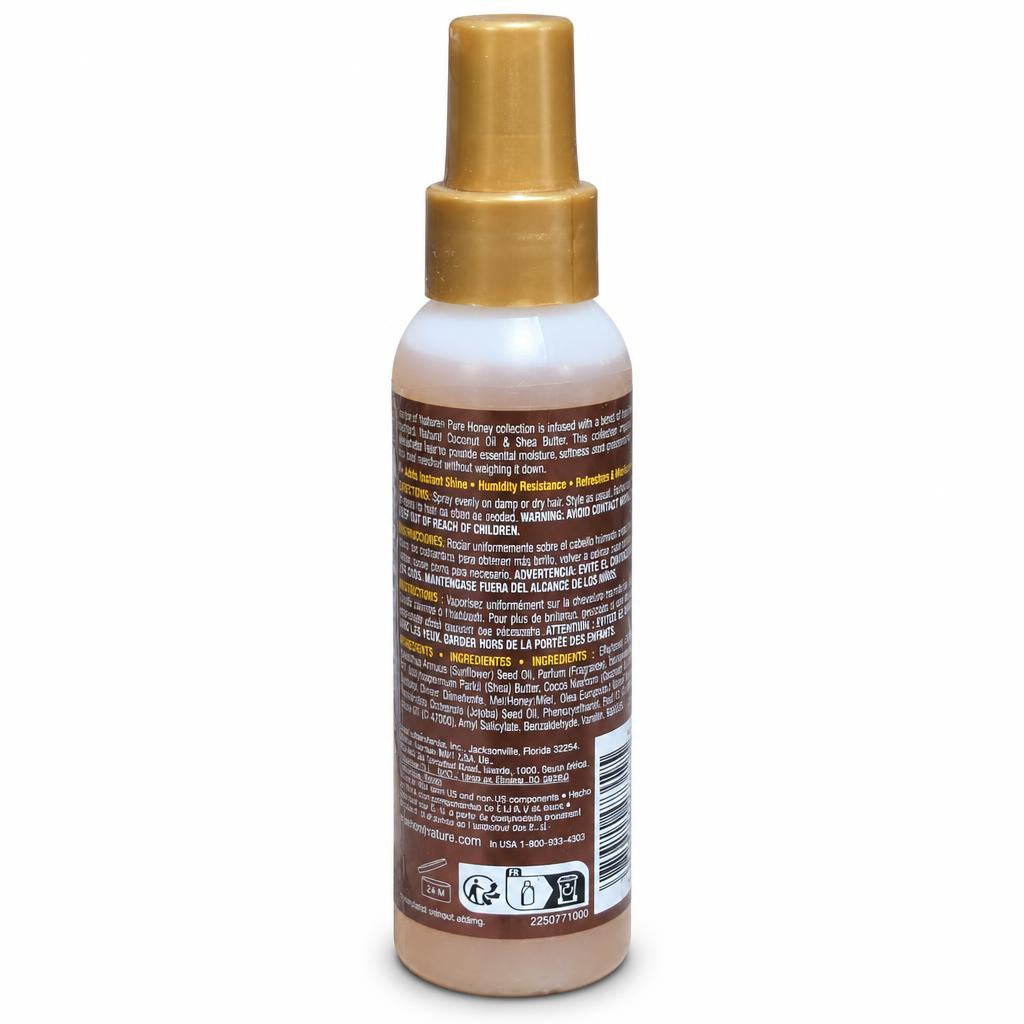 A bottle of hair developer shown from the back, featuring a gold spray nozzle and a brown label with white and yellow text.