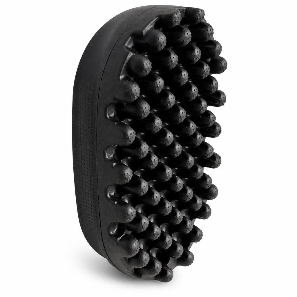 A black silicone scalp massage brush with multiple raised nubs, shown at an angle on a white background.