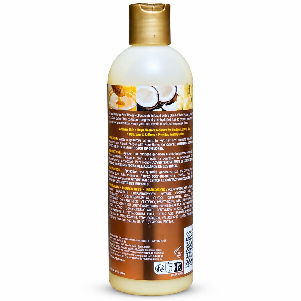 A bottle of Coconut Hair & Hair Growth Activator hair treatment, shown from the back to display the label and gold cap against a white background.