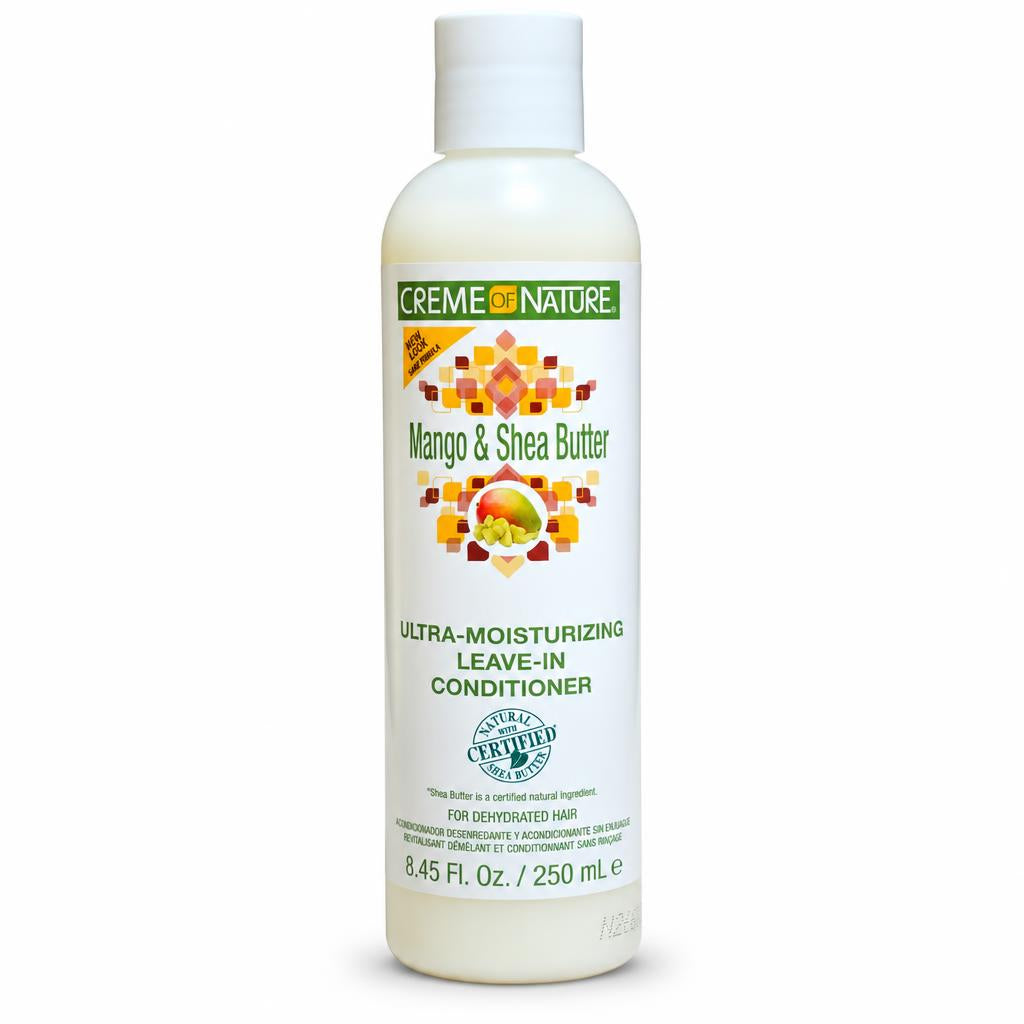 A bottle of Creme de Nature Mango & Shea Butter leave-in conditioner, 250 mL, on a plain white background.