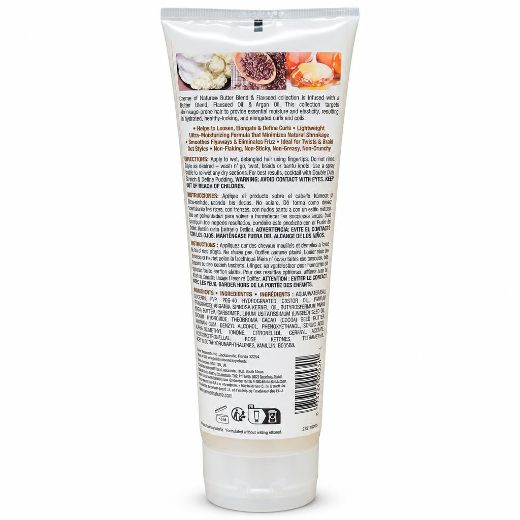 The back of a white squeeze tube for a hair care product, showing ingredient illustrations, product details in English and French, a barcode, and a small logo at the bottom, photographed on a white background.